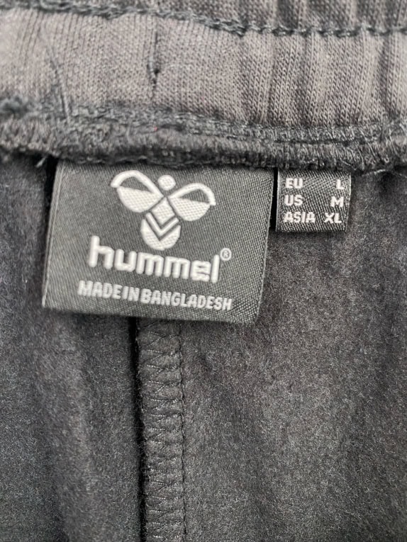 Hummel Pantaloni della tuta con logo neri da uomo L