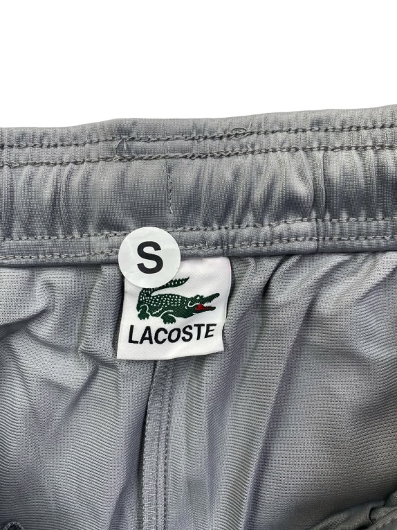 LACOSTE ΠΑΝΤΕΛΟΝΙ ΦΟΡΜΑΣ TRACK PANTS ΜΕ ΠΛΑΪΝΟ LOGO TAPE ΓΚΡΙ ΑΝΔΡΙΚΟ SMALL
