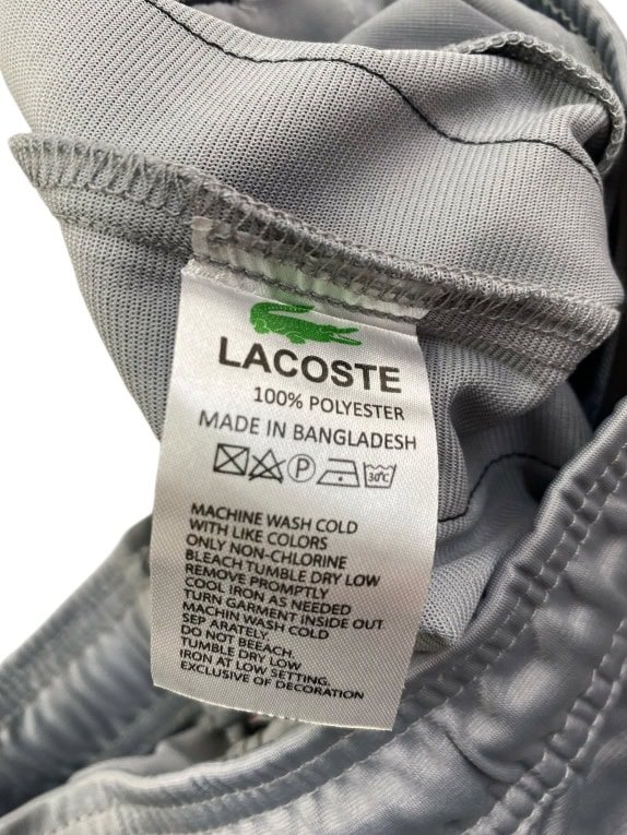 LACOSTE ΠΑΝΤΕΛΟΝΙ ΦΟΡΜΑΣ TRACK PANTS ΜΕ ΠΛΑΪΝΟ LOGO TAPE ΓΚΡΙ ΑΝΔΡΙΚΟ SMALL