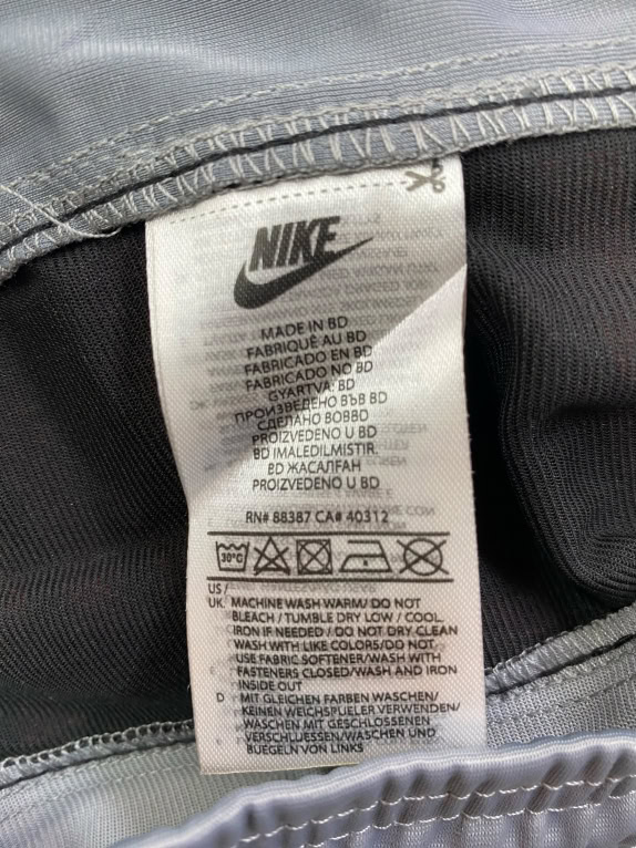 NIKE ΠΑΝΤΕΛΟΝΙ ΦΟΡΜΑΣ TRACK PANTS ΜΕ ΠΛΑΪΝΕΣ ΦΑΣΕΣ LOGO TAPE ΓΚΡΙ ΑΝΔΡΙΚΟ S